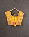 A floral chiffon georgette saree in yellow paired with a stunning blouse pattern