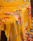 A floral chiffon georgette saree in yellow paired with a stunning blouse pattern