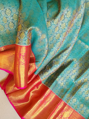 Turquoise Blue kanjeevaram saree with a contrast majenta pink border