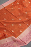 An exquisite Silk Saree in burnt orange and rose pink