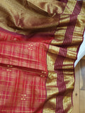 A stunning vintage kanjeevaram in rust orange with a deep maroon border