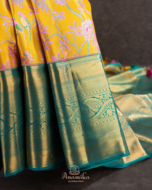 A meenakari kanjeevaram saree in yellow and teal