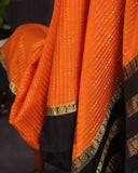 Orange mysore crepe silk saree with a stunning blouse pattern