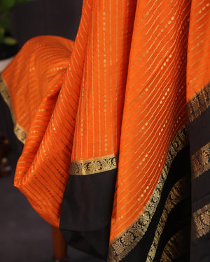 Orange mysore crepe silk saree with a stunning blouse pattern