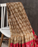 Twill Patola saree in a lovely shade of light brown and red