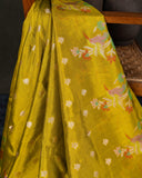 Mustard yellow organza saree with a contrast orange blouse