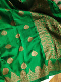 Banarasi Dupion saree in dark green with gold Zari border and motifs