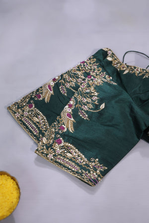 An exquisite kanjeevaram saree in deep maroon and emerald green combo