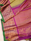 Royal Gadwal kanchiPattu saree in a beautiful parrot green and magenta combination