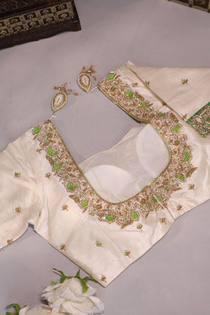 Green Tissue Kanchi saree with a contrast off white blouse