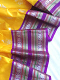 Venkatagiri Pattu saree in yellow with a contrast purple blouse