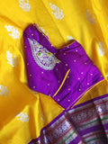 Venkatagiri Pattu saree in yellow with a contrast purple blouse