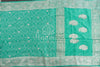 Teal green Banarasi chiffon saree with chikankari work all over