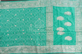 Teal green Banarasi chiffon saree with chikankari work all over