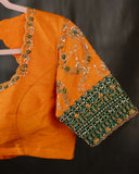 Kanchi soft silk saree in an evergreen green and light orange combo