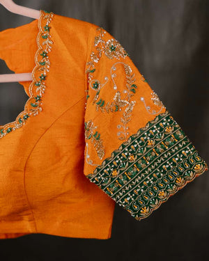 Kanchi soft silk saree in an evergreen green and light orange combo