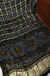 Black Bandini Gharchola saree with a showstopper blouse patter
