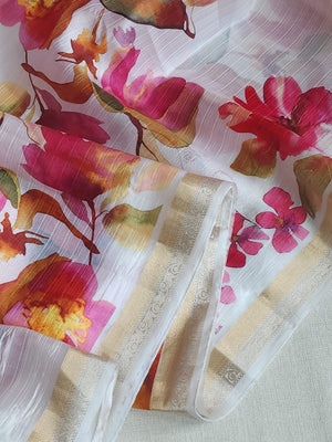 White floral pure silk saree with a contrast pink blouse