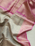 Kanjeevaram in a beautiful shade of gray with a contrast pink border.