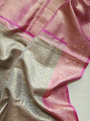 Kanjeevaram in a beautiful shade of gray with a contrast pink border.
