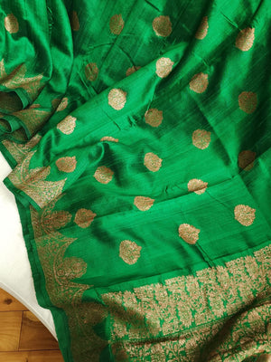 Banarasi Dupion saree in dark green with gold Zari border and motifs