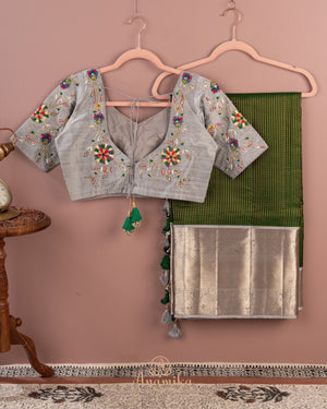 Dark green kanjeevaram saree with contrast grey border and pallu