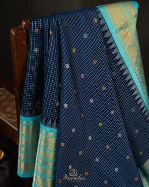 Timeless Gadwal Pattu saree in deep navy and teal blue