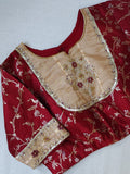 Banarasi Gold Tissue saree paired with a contrast maroon blouse