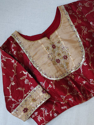 Banarasi Gold Tissue saree paired with a contrast maroon blouse