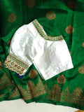 Banarasi Dupion saree in dark green with gold Zari border and motifs
