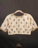 Off white blouse with beautifully designed Patola-inspired embroidery