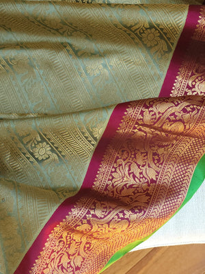 A Royal Gadwal kanchi saree in sage green with rich magenta border