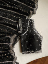 Falling organza saree in black with all over sequins work
