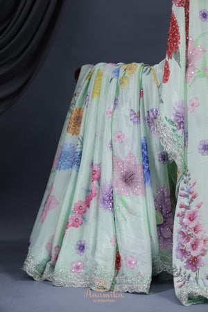 Mint Green Crepe Floral saree with hand worked border
