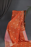 An exquisite Silk Saree in burnt orange and rose pink