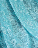 A contemporary lace saree in pastel blue with a stunning blouse pattern