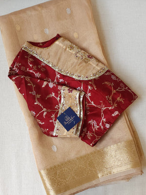 Banarasi Gold Tissue saree paired with a contrast maroon blouse