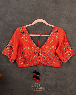 Orange Elbow sleeves blouse with intricately designed gold and black thread work