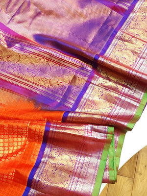 A grand Gadwal Kanchi saree in orange for your joyous occasions