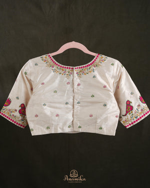Off white blouse with beautifully designed Patola-inspired embroidery