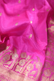 Raw Mango saree in bubble gum pink paired with a contrast dark green blouse