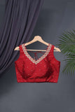 Red sleeveless blouse with handwork