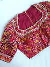 Flowy Malai silk saree in grey paired with a red Patola blouse