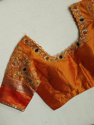 Traditional Green and rust orange Kanchipattu saree
