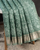 Organza saree in sage green with all over thread embroidery