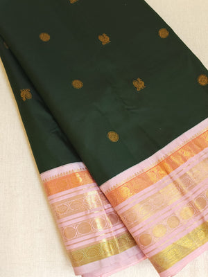 Kanjeevaram saree in bottle green with a baby pink border