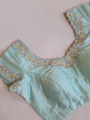 Pastel Blue soft organza saree with a mono tone blouse