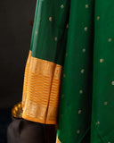 Kanchi soft silk saree in an evergreen green and light orange combo