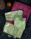A kanjeevaram saree in purple with pastel green combo