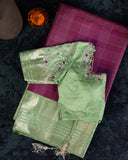 A kanjeevaram saree in purple with pastel green combo